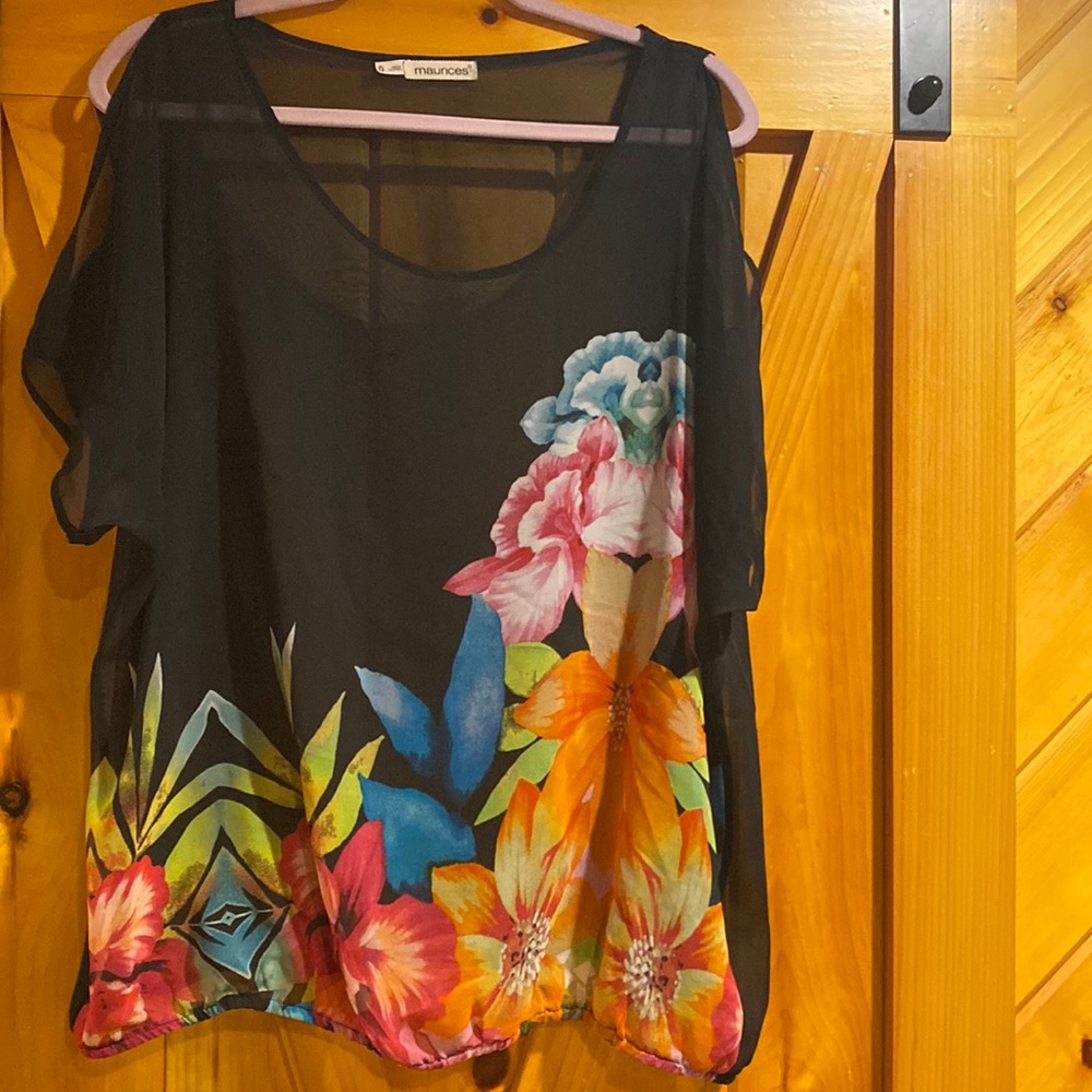 Sheer top, looks great with a tank top underneath.